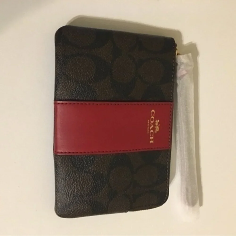 Coach signature coated canvas wristlet